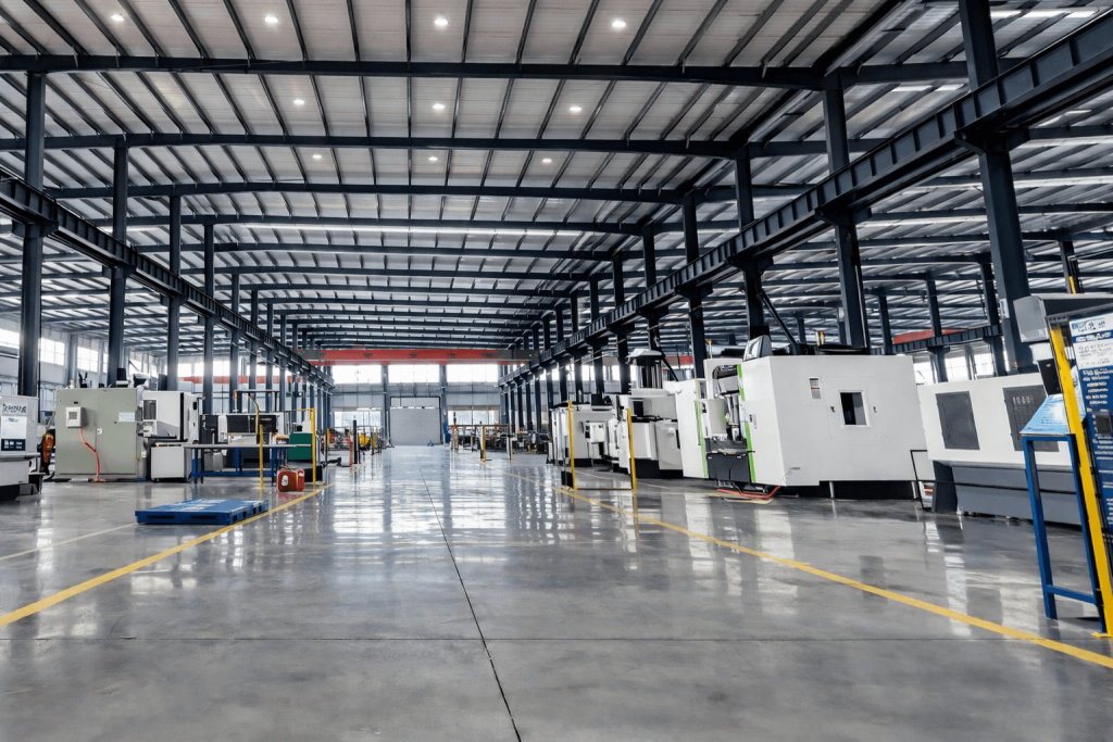 Large CNC machining workshop with multiple industrial machines in organized production layout