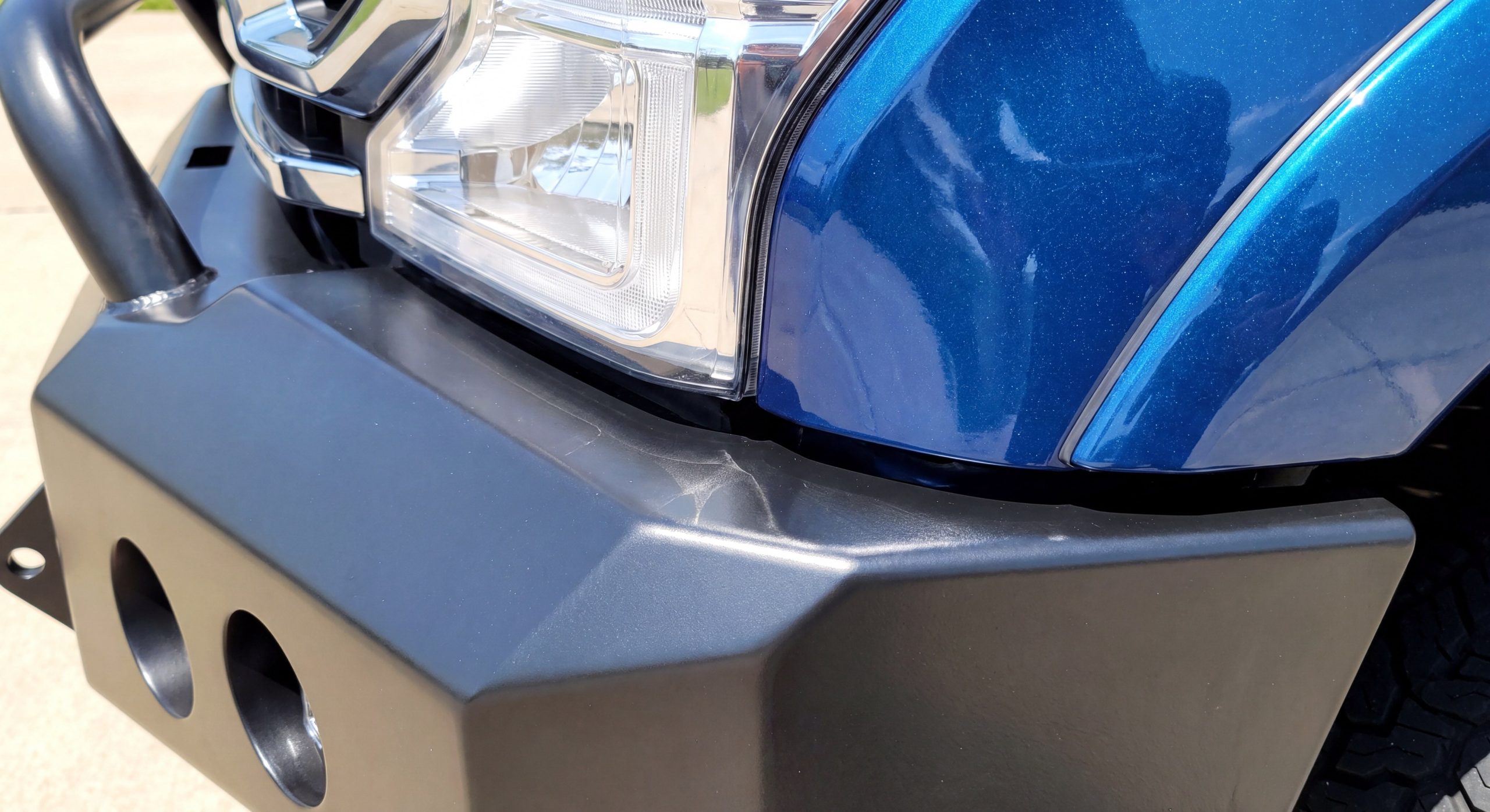 Inspecting clearance and fitment on a steel bumper